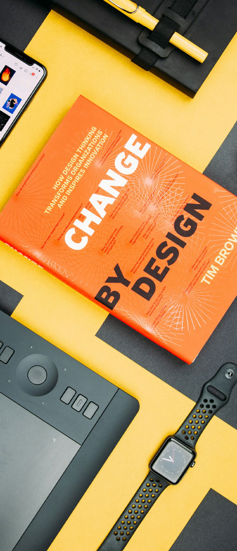 A picture featuring a graphic design book called Design by Change