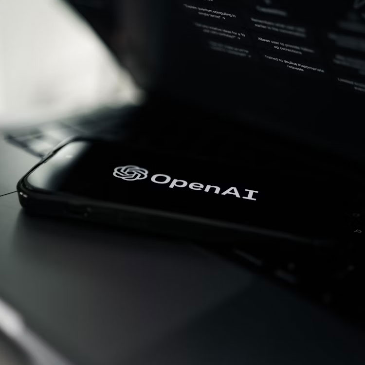 A picture featuring the Open Ai logo.